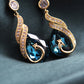💎🔥 PROMO FLASH 50% ! Boucles d'oreilles Phoenix Étincelantes en Or Plaqué – Zirconia Cubique AAA, 2 Options (Saphir Bleu ou Perle), 6.9×1.2 cm, Cadeau Parfait pour Événements Spéciaux ✨