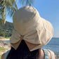 👒🌞 PROMO FLASH 50% ! Chapeau de Soleil Femme à Bords Extra Larges avec Nœud – Tissu Respirant, Flexible, 3 Couleurs, Couverture 360°, Parfait pour Plage, Voyage & Vacances 🌴
